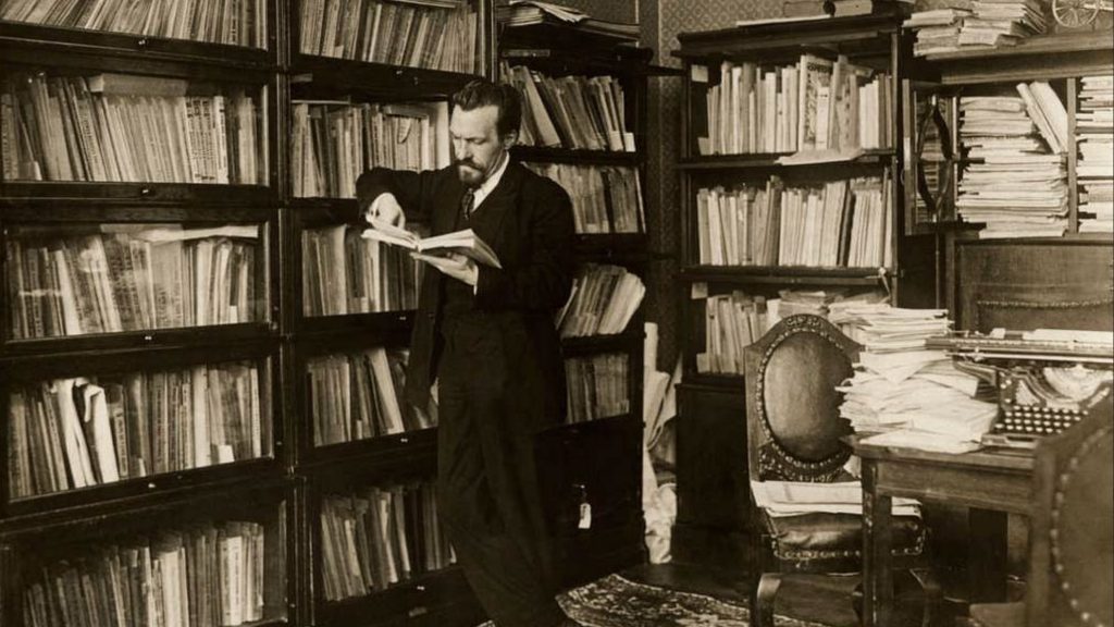 Reading a book in a library, probably not about to run it.